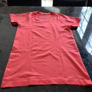 Lululemon, short sleeve top , peach color , size 8 , good condition
